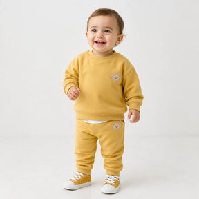 Conjunto de moletom infantil amarelo em algodão macio, estilo esportivo que garante conforto para seu bebê nas brincadeiras